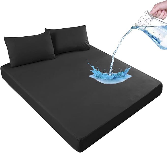 Black mattress cover with water being poured onto it, indicating water resistance.
