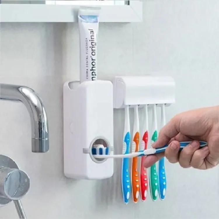 Automatic toothpaste dispenser and toothbrush holder