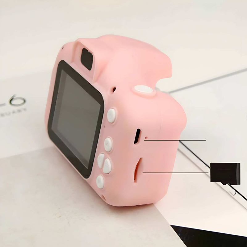 Pink toy camera with screen and buttons on a light background